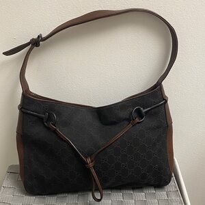 This is a vintage Gucci Horsebit hobo bag in brown leather and black denim.